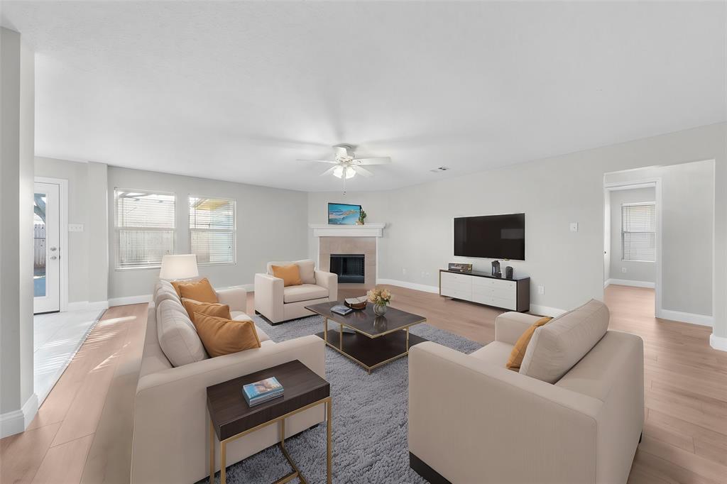 a living room with furniture and a flat screen tv