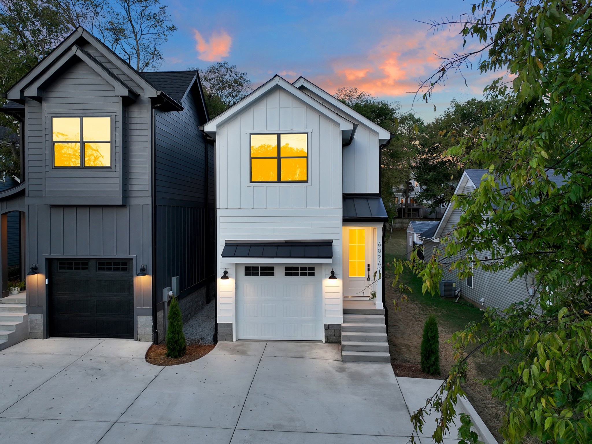 a front view of a house with yard and garage