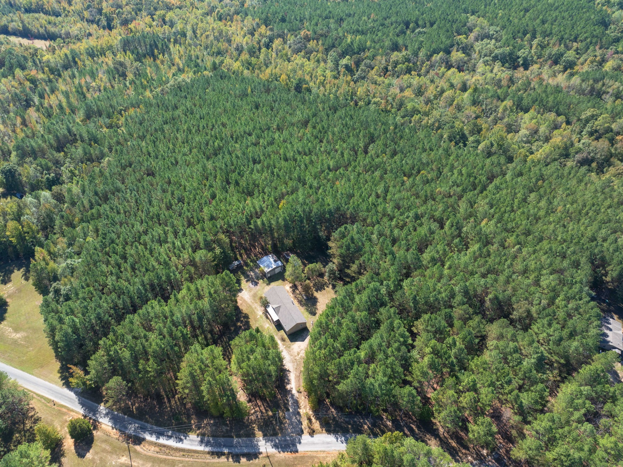 an aerial view of a house with yard