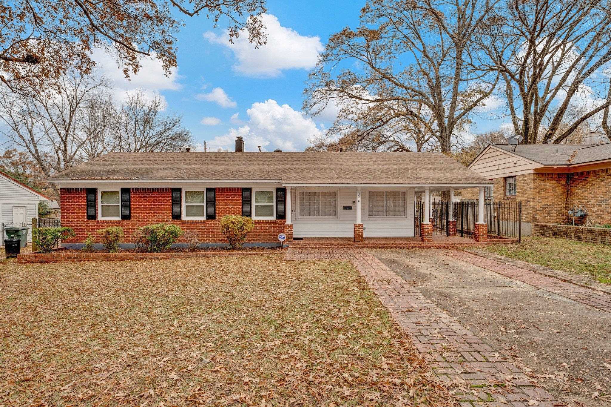 Ranch-style home featuring a porch