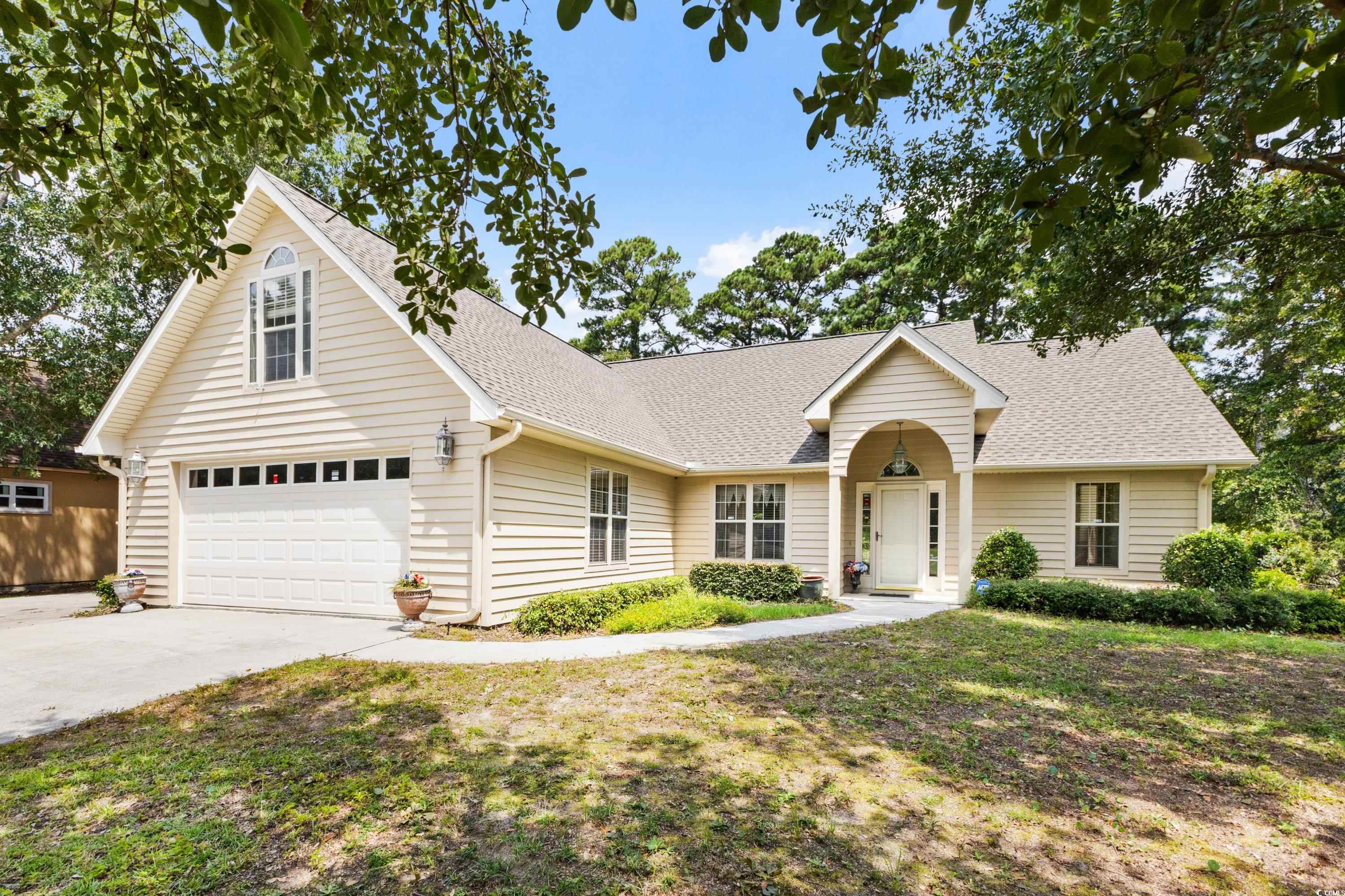 View of front of home featuring a front yard and a