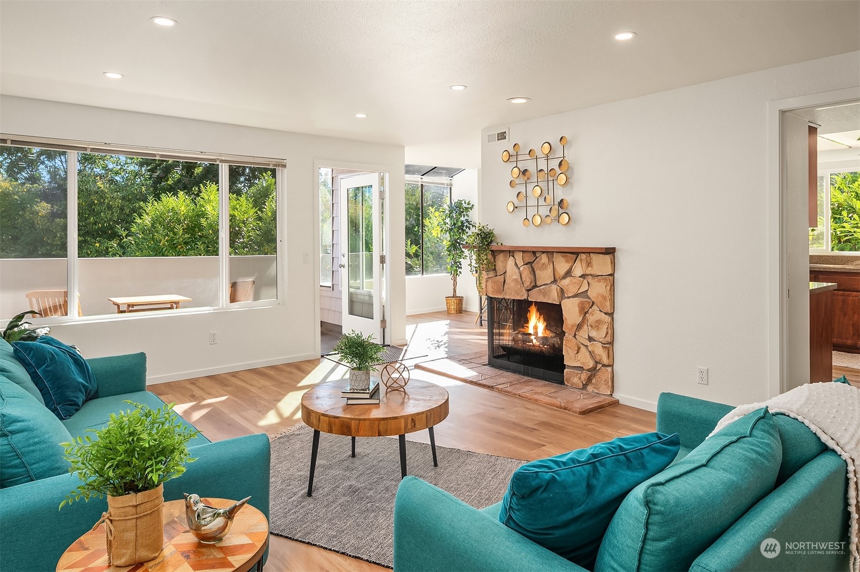 a living room with furniture and a fireplace