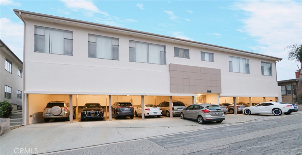 a view of a cars park in front of house