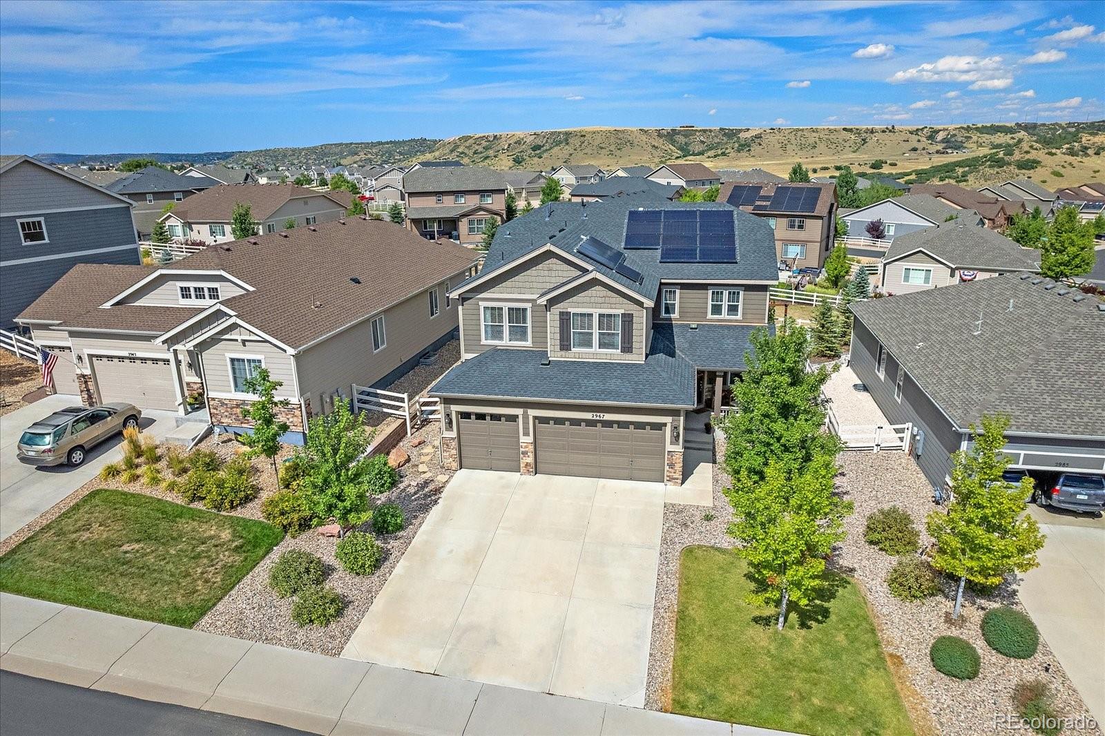 an aerial view of a house with a garden