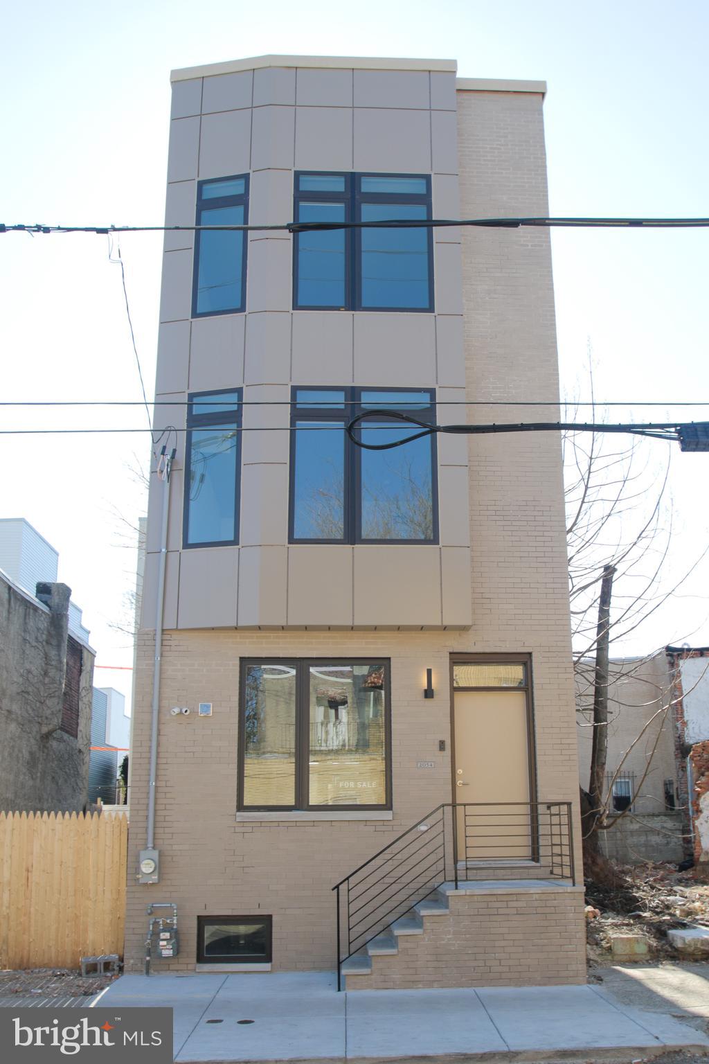 a view of a brick building with entryway