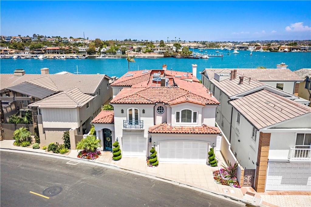 an aerial view of a house with a ocean view