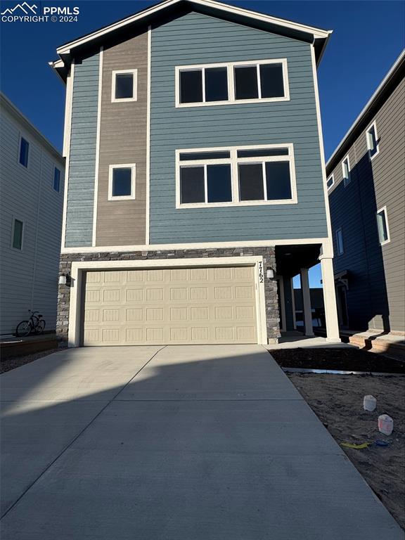 a front view of a house with a garage