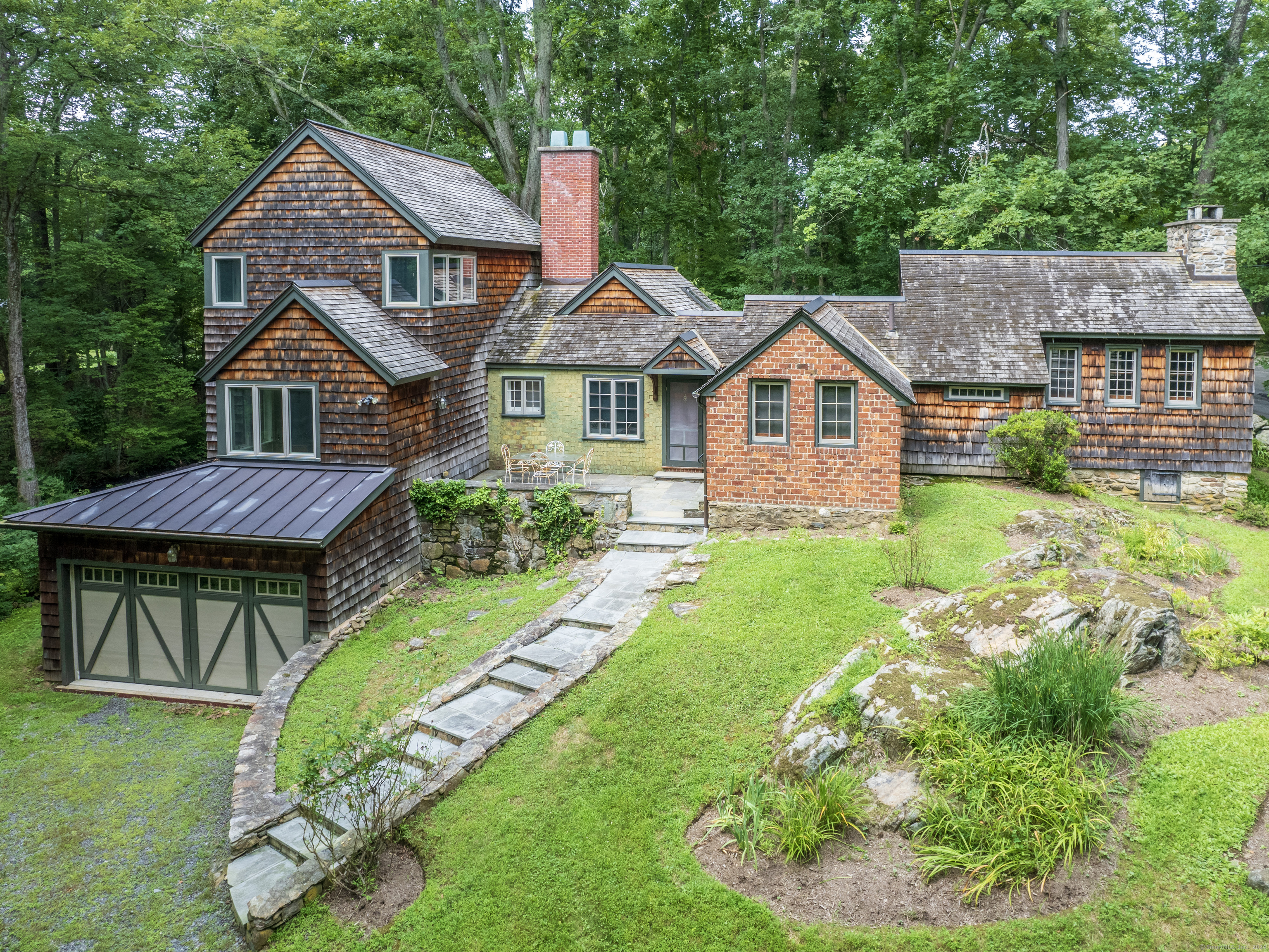 a front view of a house with garden