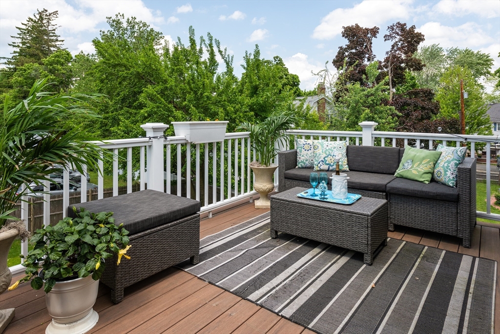 a balcony with wooden floor