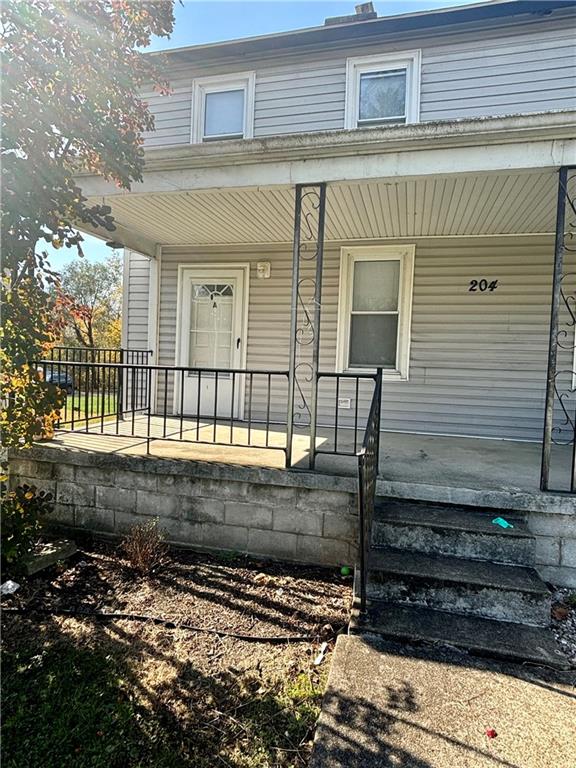 a view of a house with a small yard