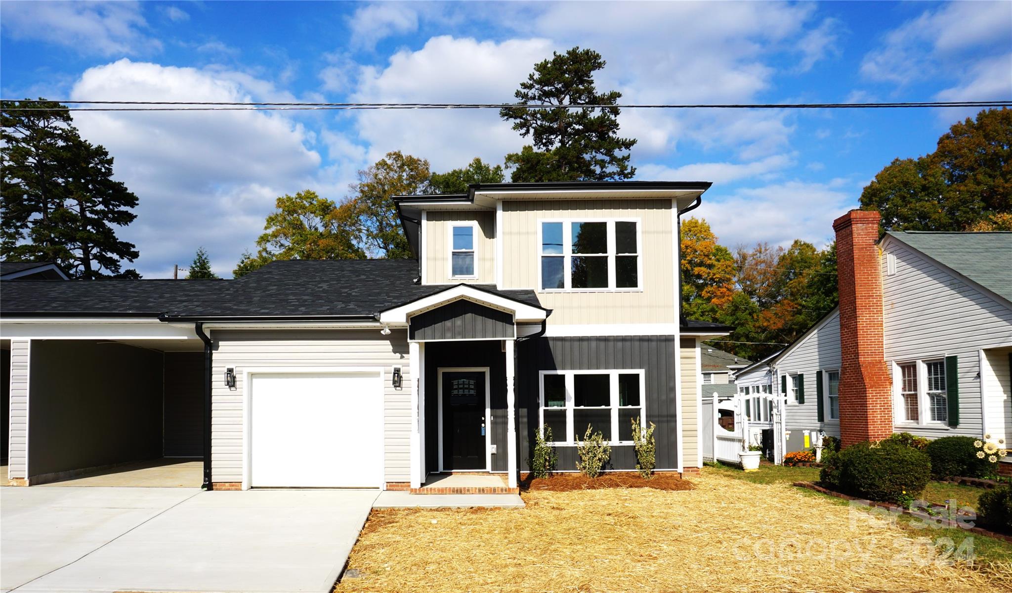 a front view of a house with a yard