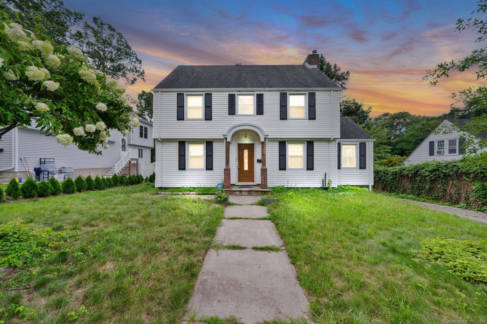 front view of a house with a yard