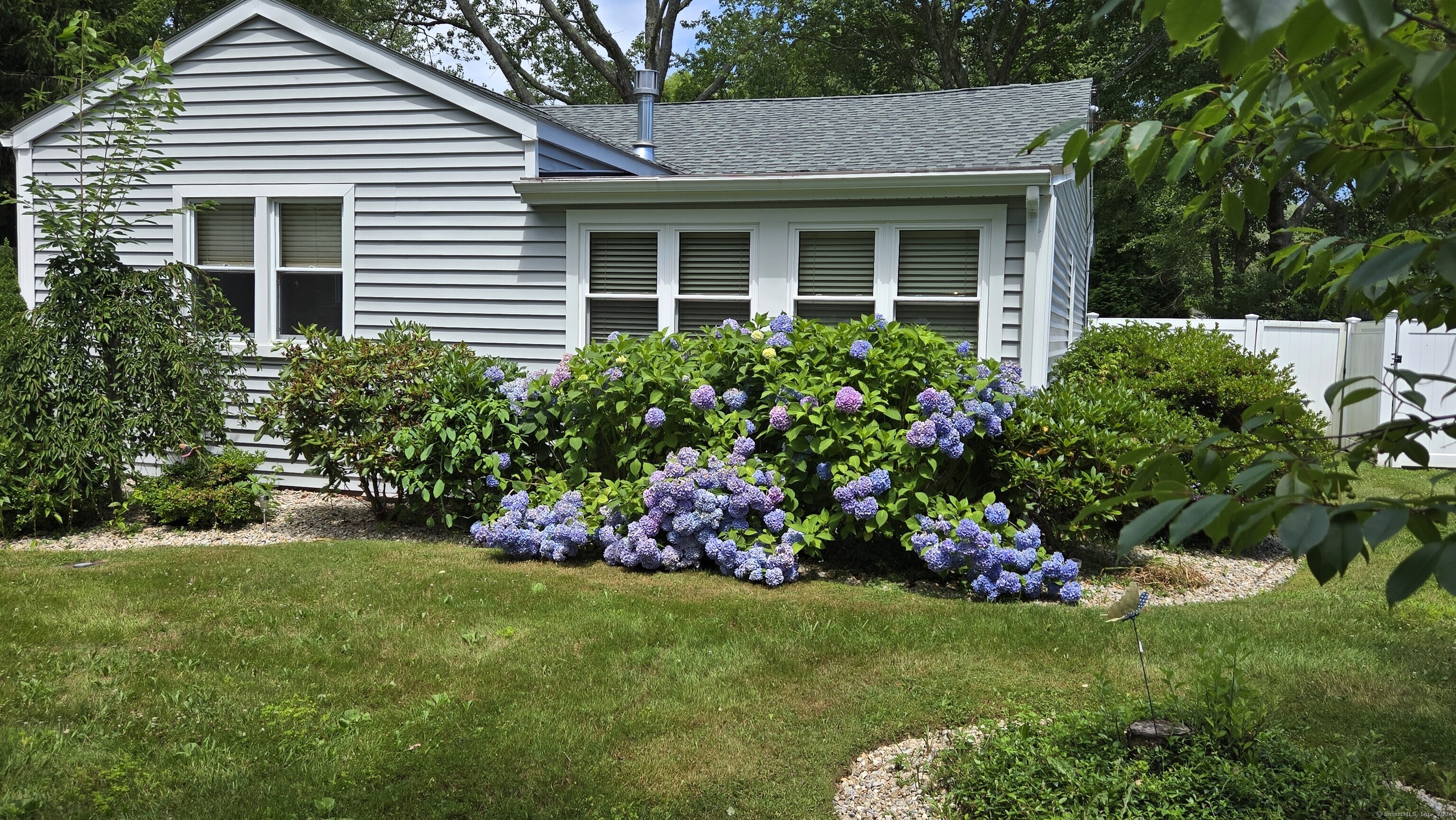 a view of a house with a garden