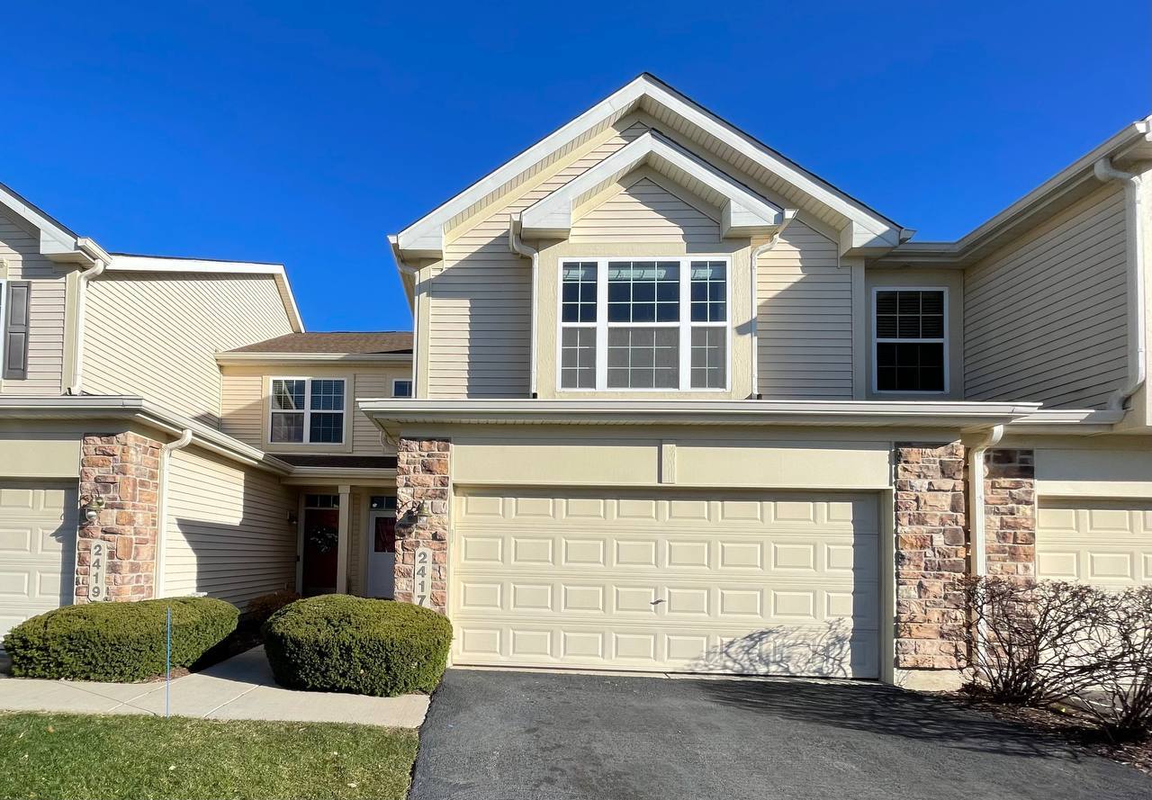 a front view of a house with a garage