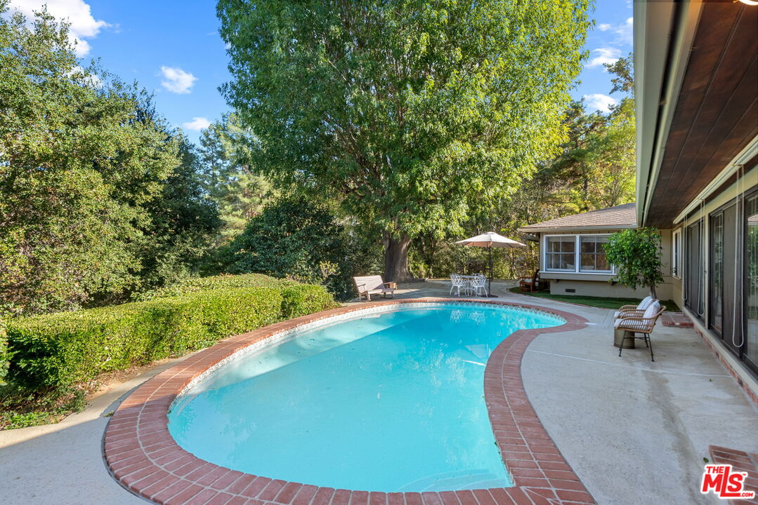 a view of a house with swimming pool