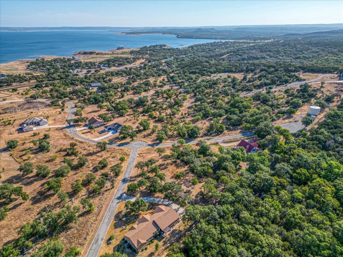 an aerial view of residential building and ocean