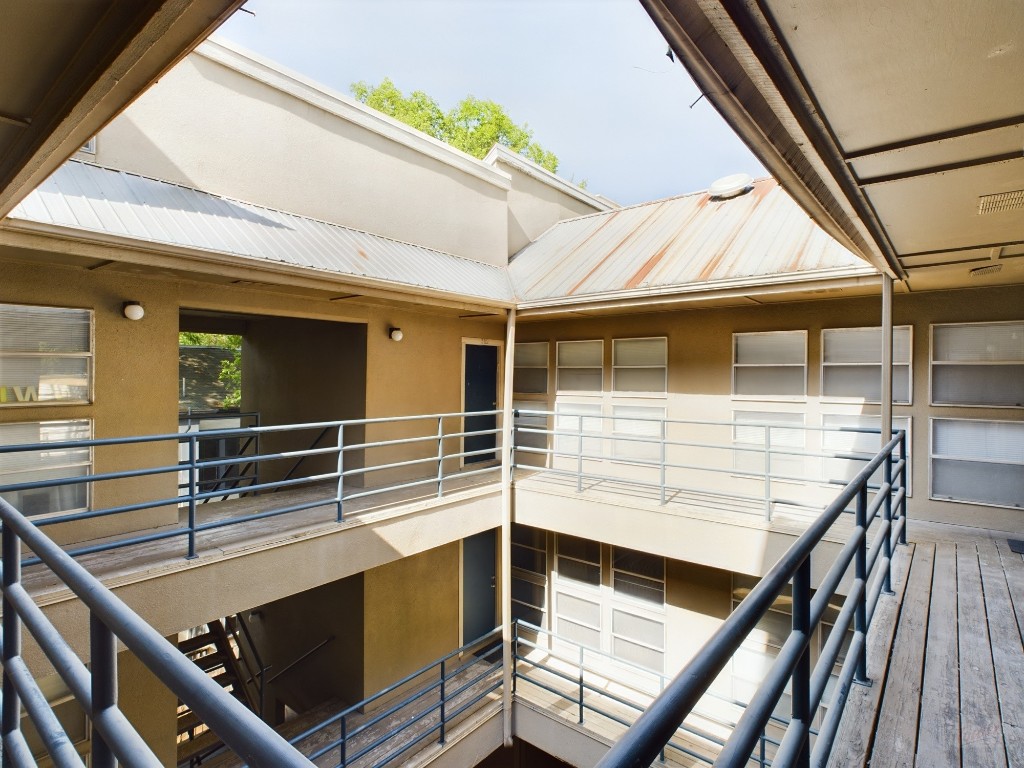 a balcony view with two windows