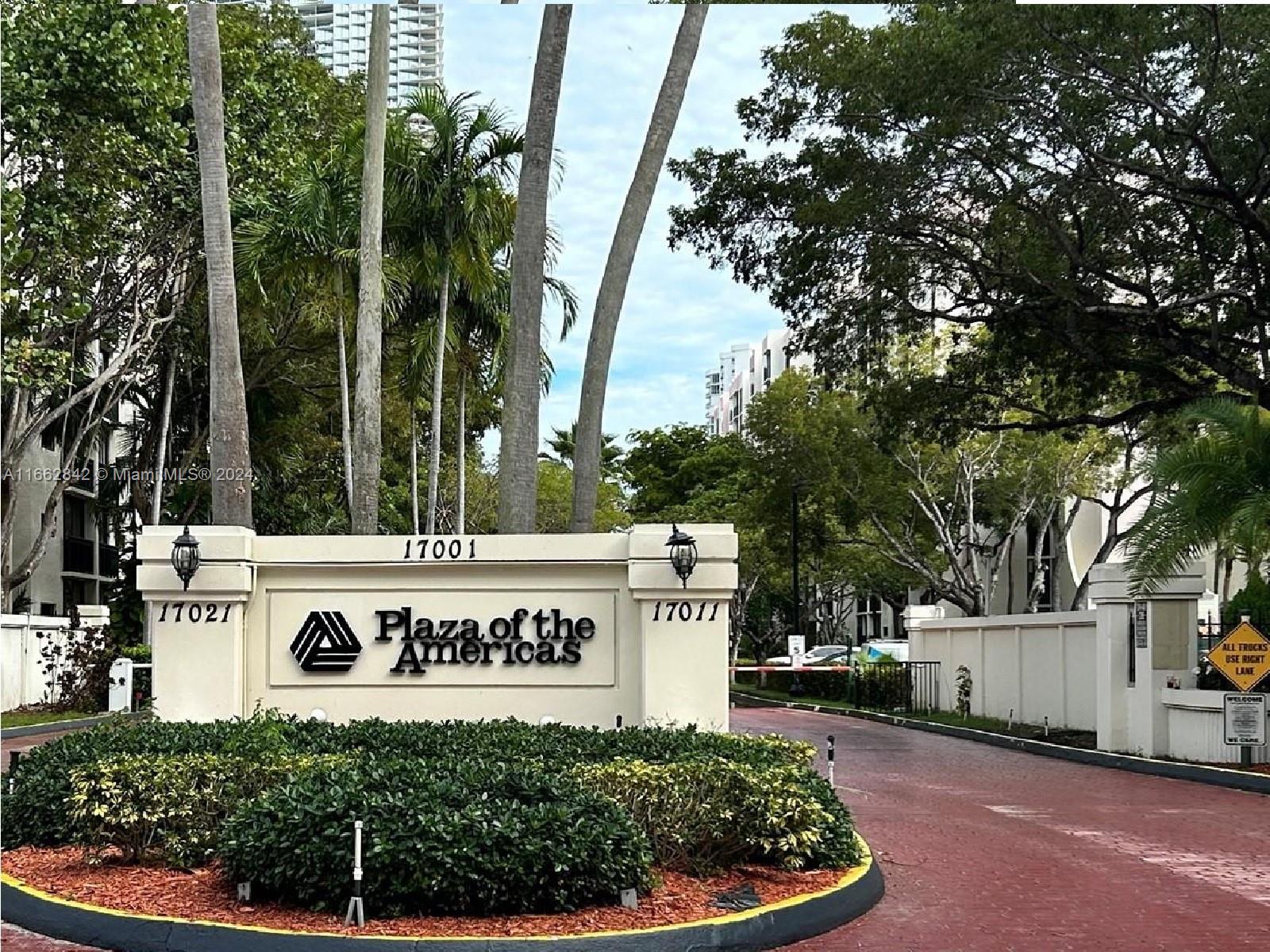 a view of outdoor space with signage and flags