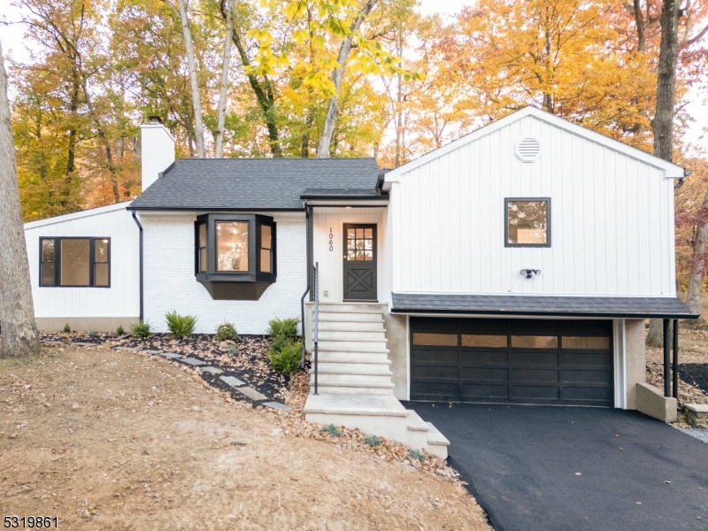 a front view of a house with garage