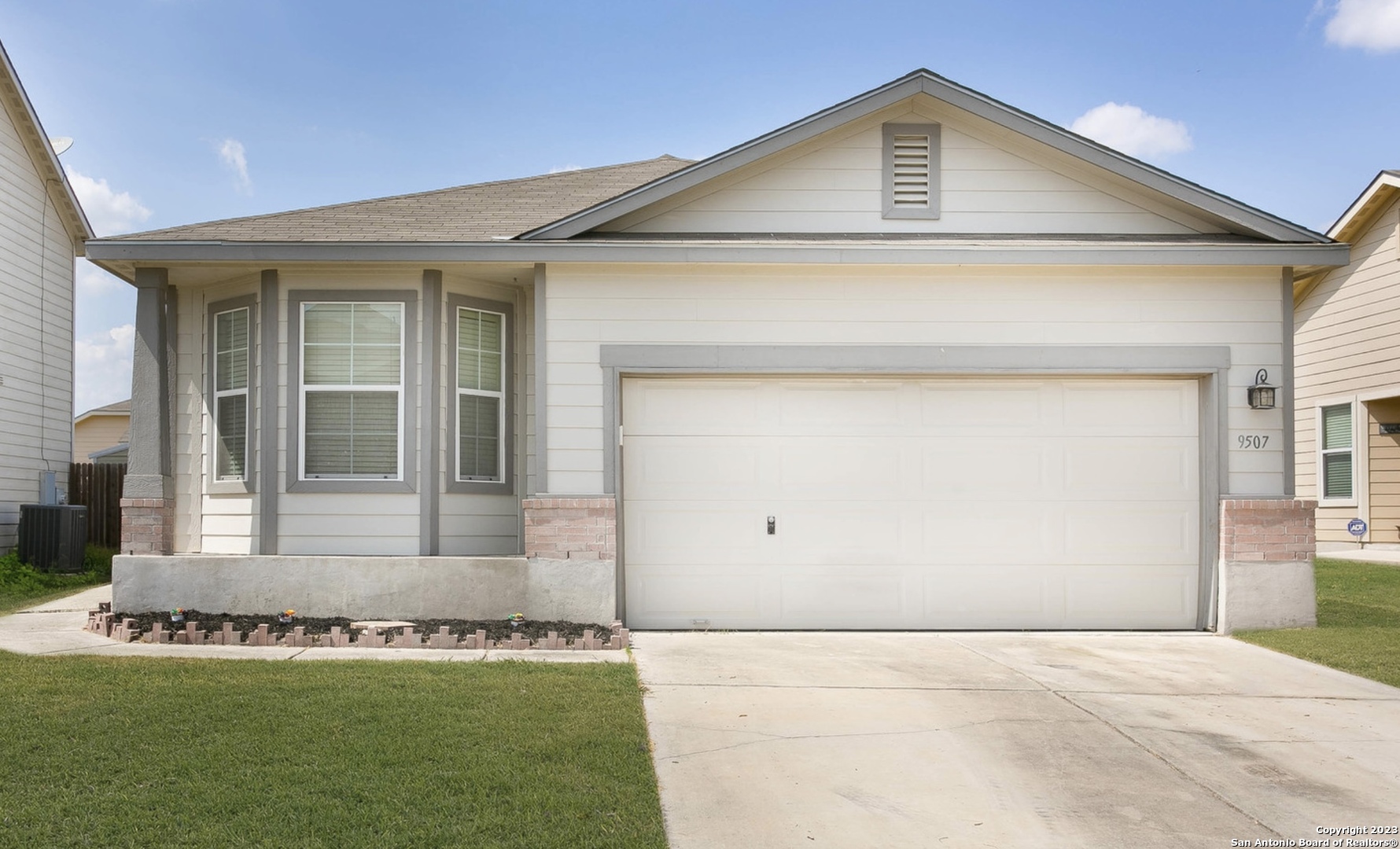 front view of a house with a yard