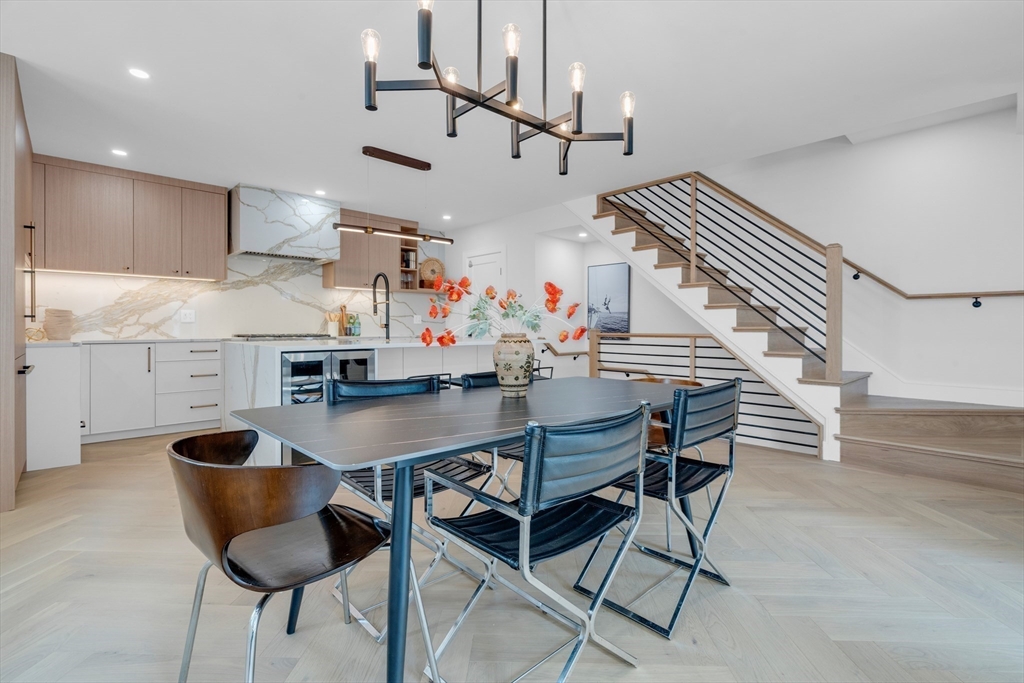 a room with stainless steel appliances kitchen island granite countertop furniture and a kitchen view