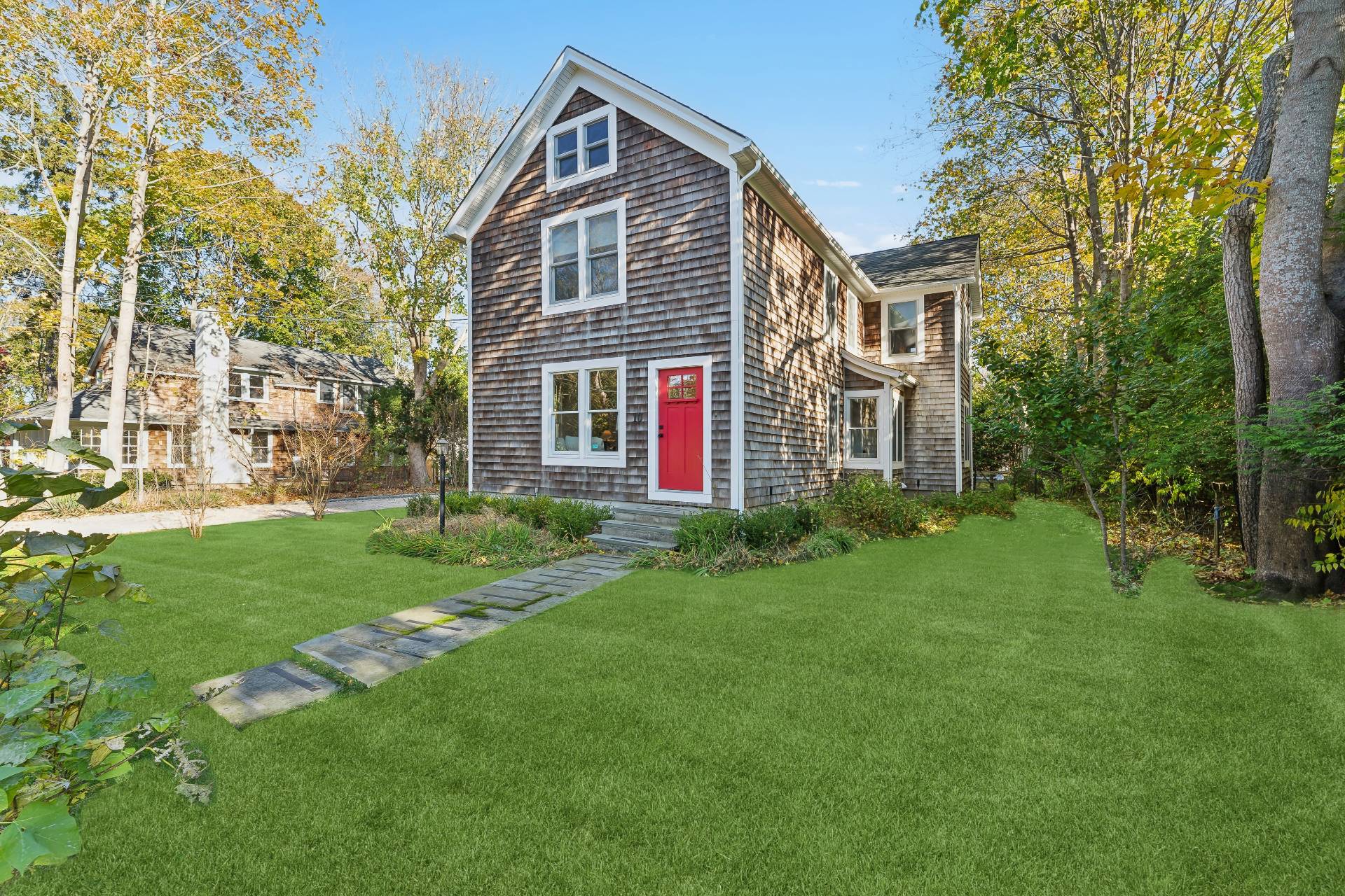 front view of a house with a yard