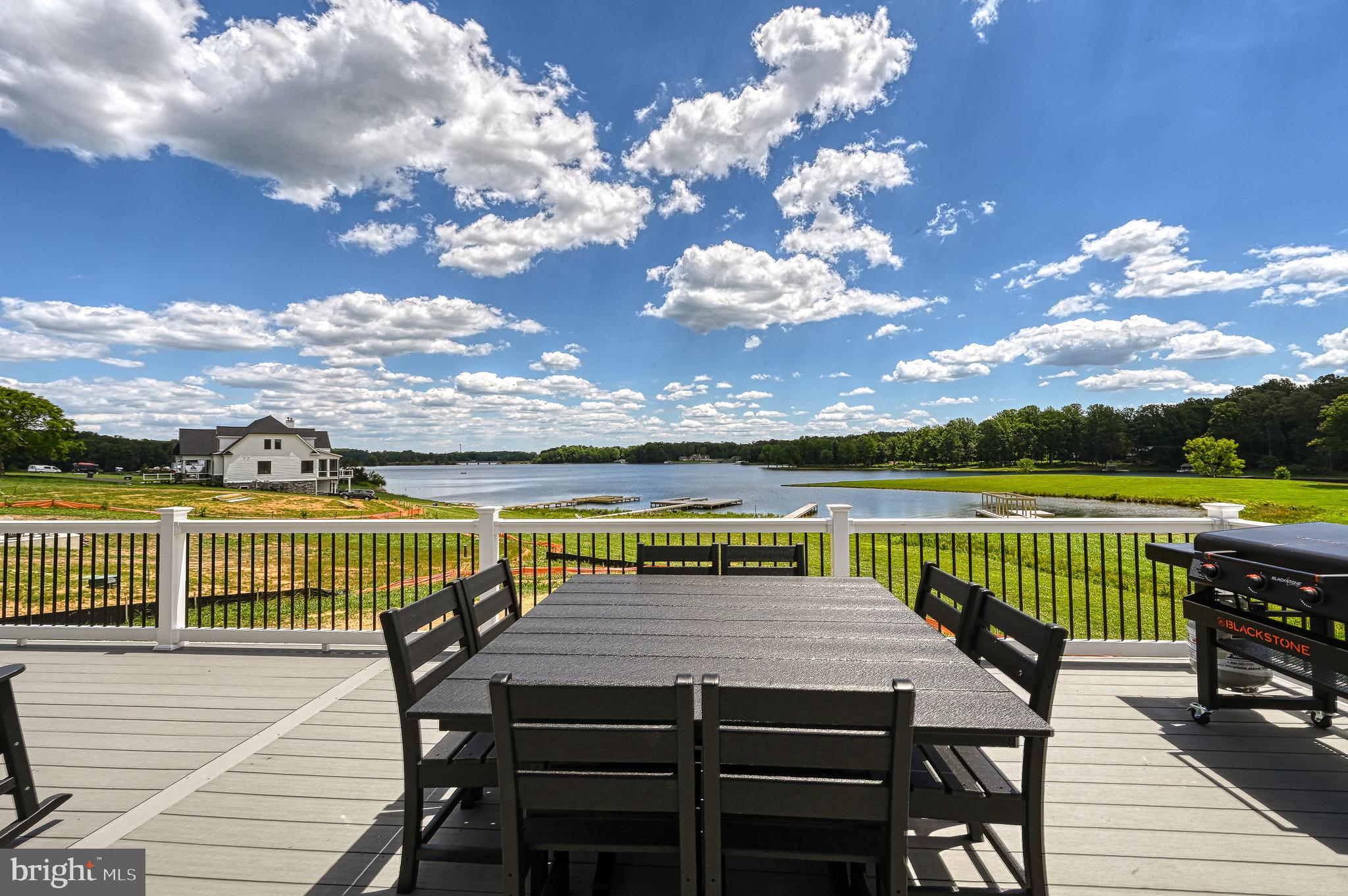 a view of a roof deck with patio