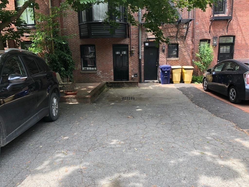 a view of a car park in front of a building