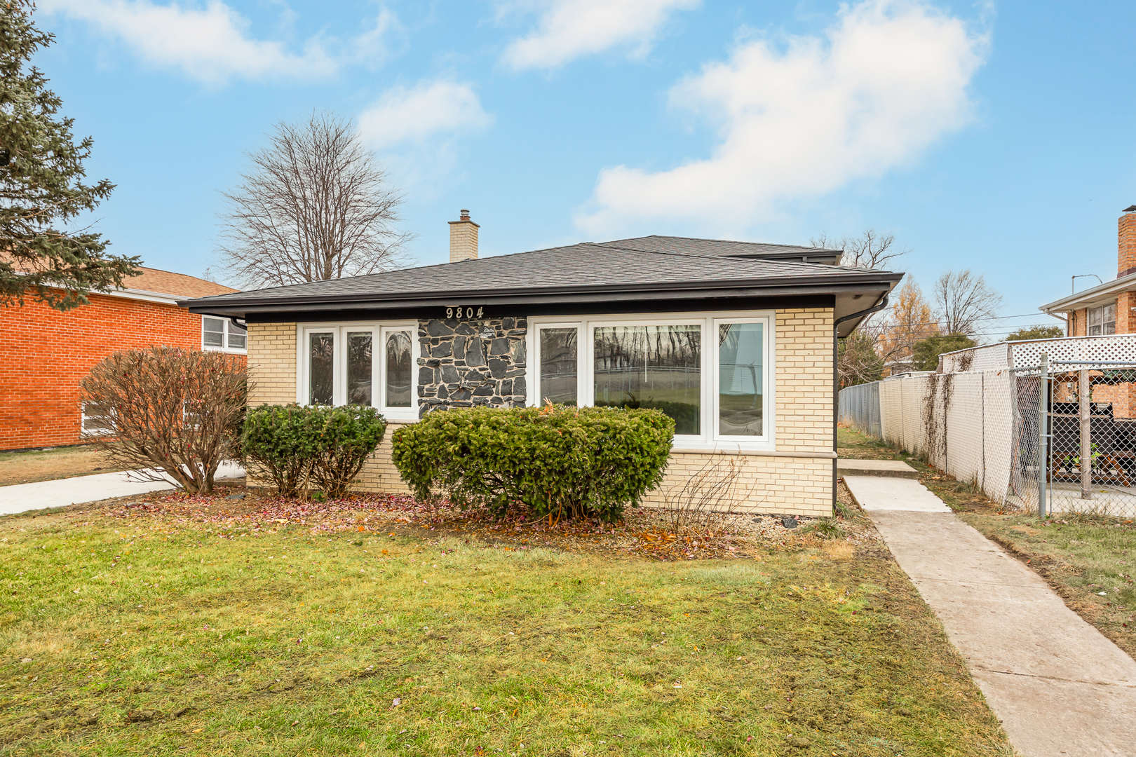 a front view of a house with a yard