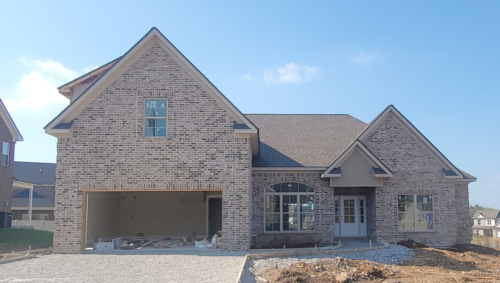 a front view of a house with garage