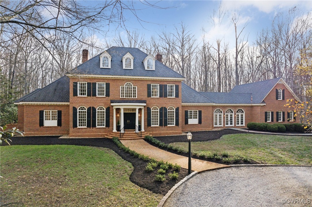 front view of a house with a yard