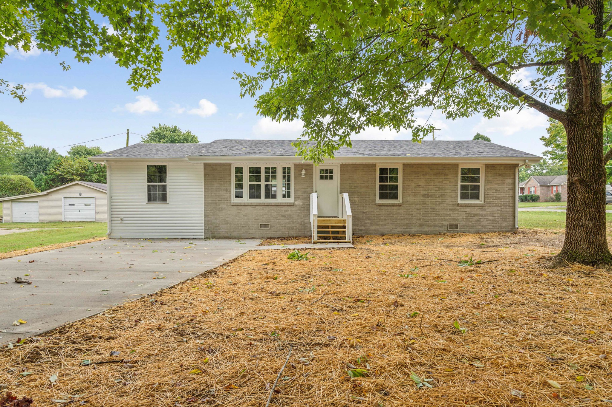 a house with trees in the background