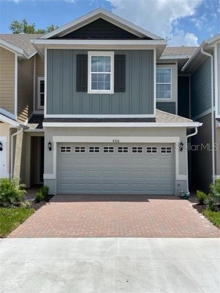 a view of a house with a garage