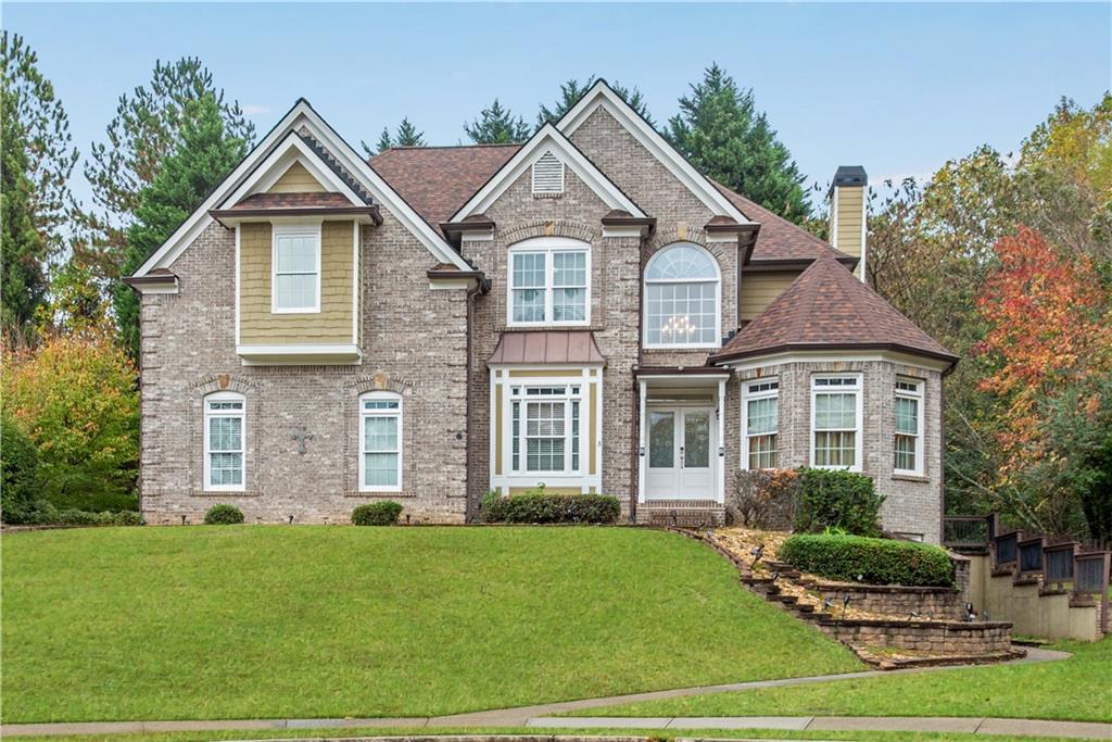 a front view of a house with a yard