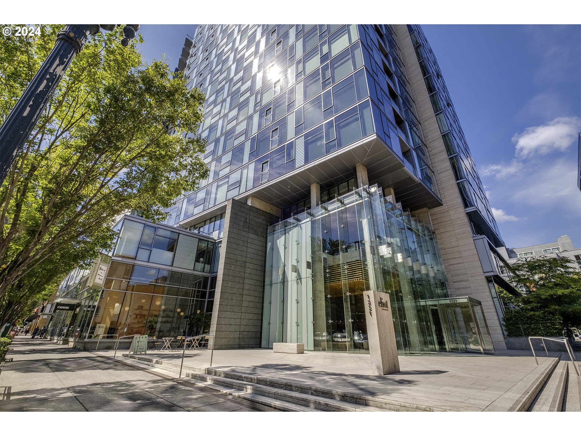 a view of a building with a tree