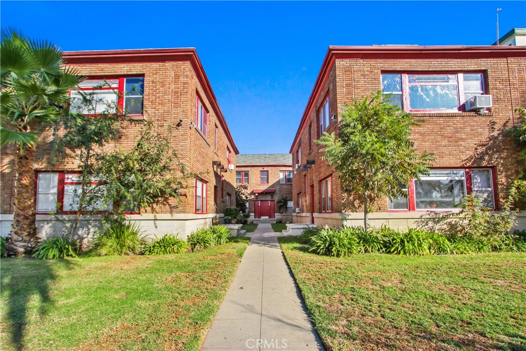 a view of house with yard