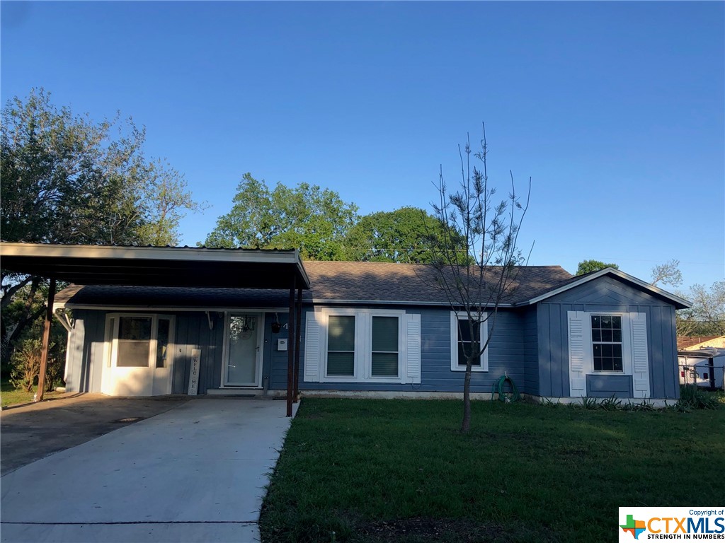 front view of a house with a yard