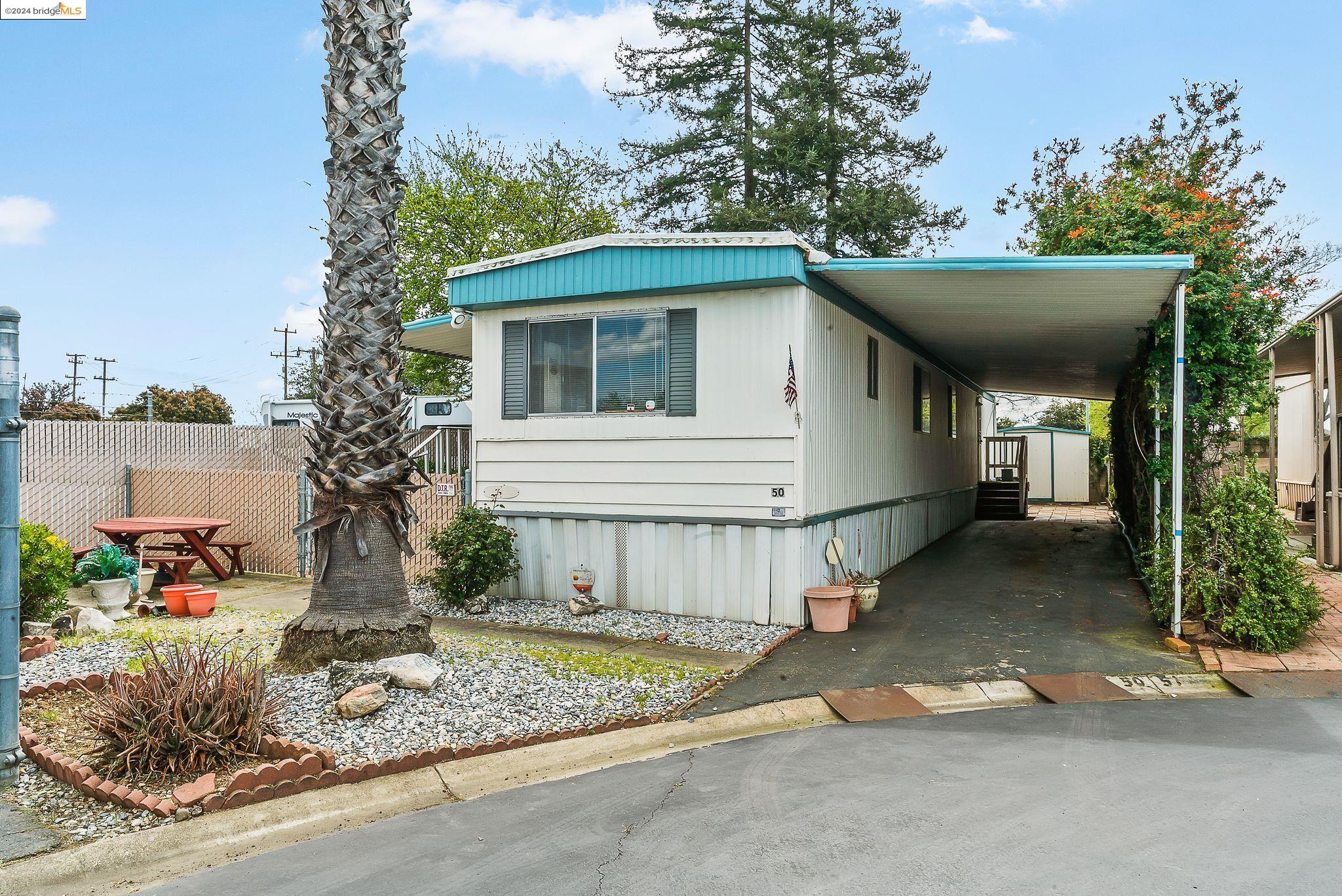 a view of a house with a yard and garage