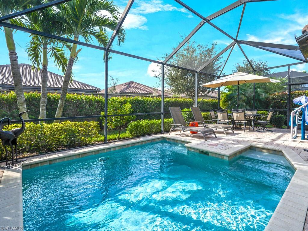 a view of swimming pool with a patio