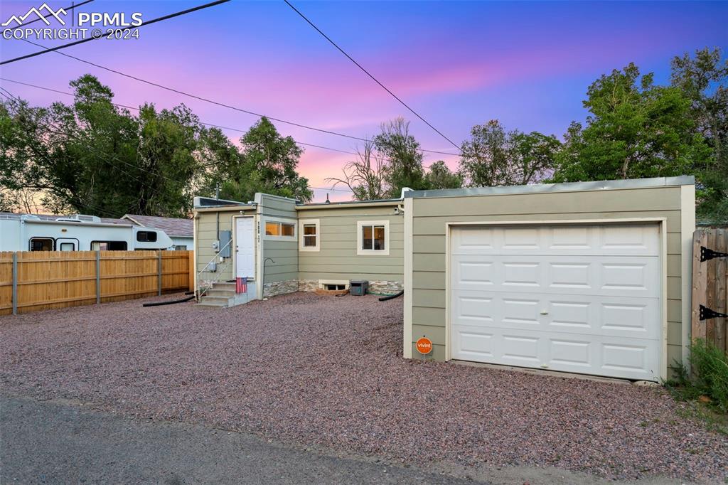 a view of a house with a backyard