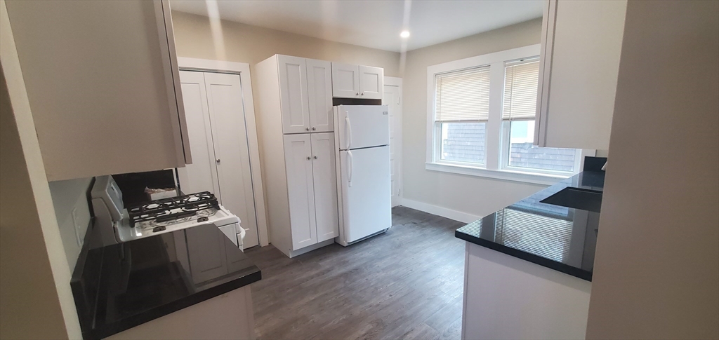 a room with furniture and wooden floor