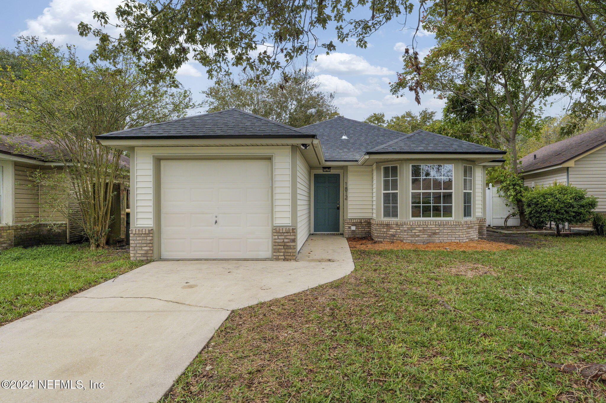 front view of a house with a yard