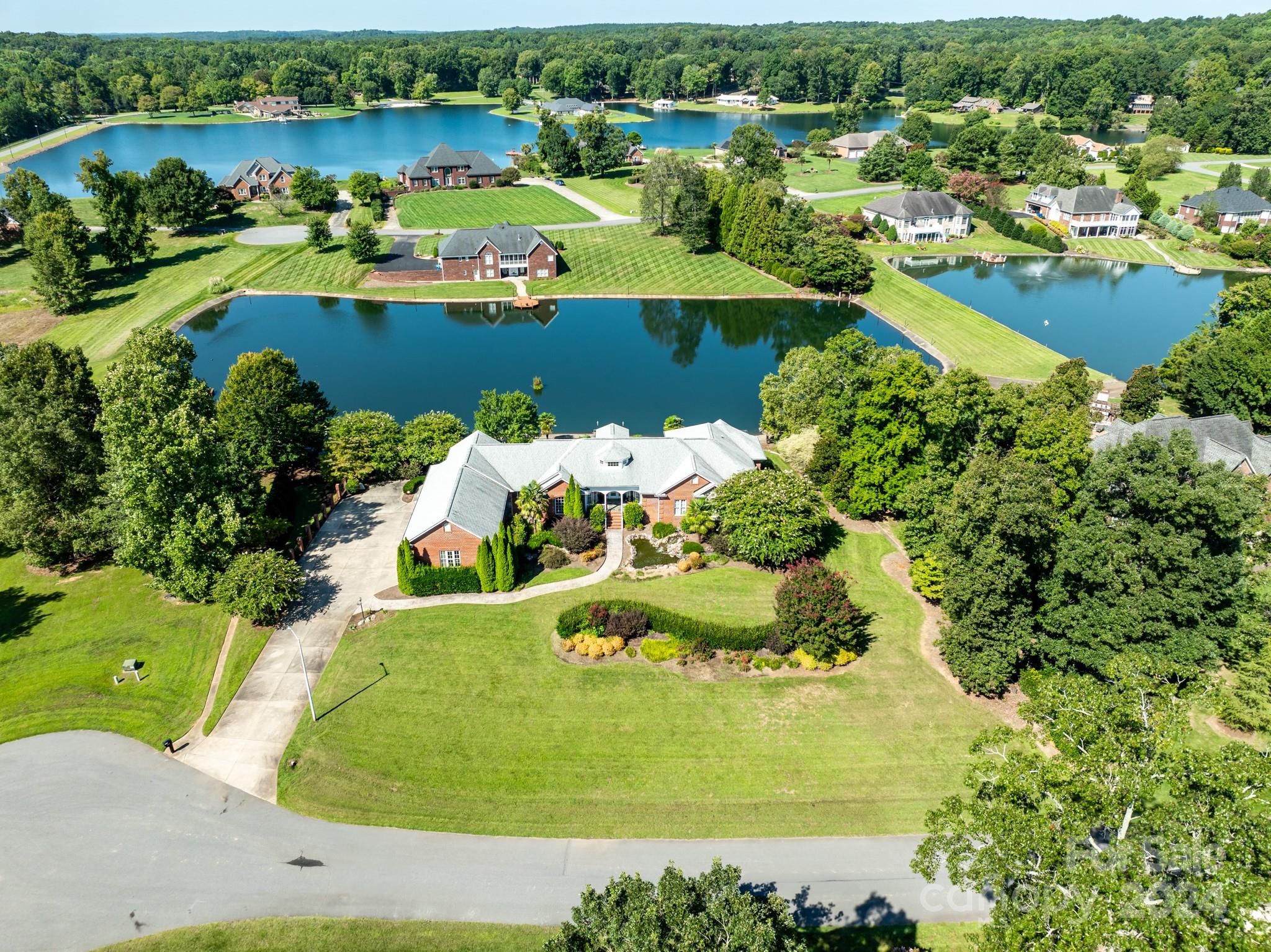 an aerial view of a house with a lake view