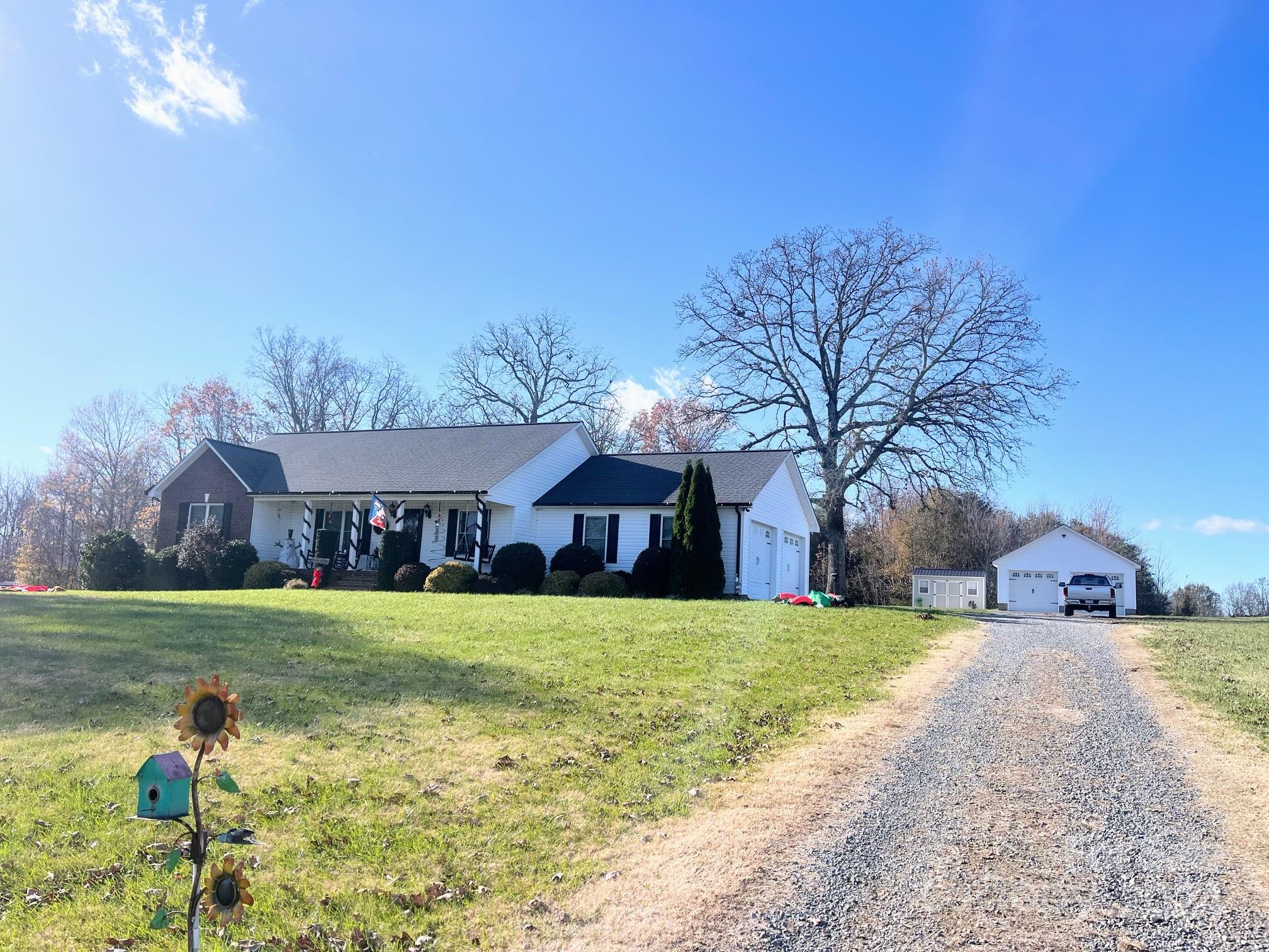 a view of a house with a yard