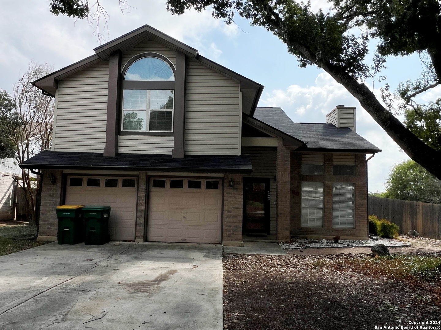 a front view of a house with garage