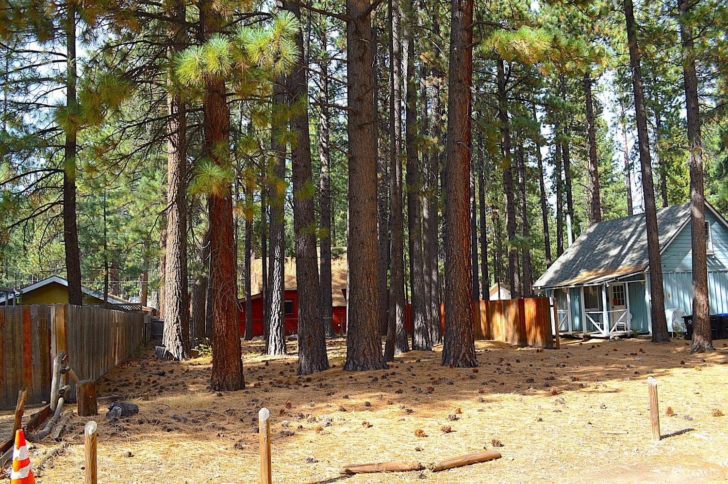 a view of a house with trees in the background