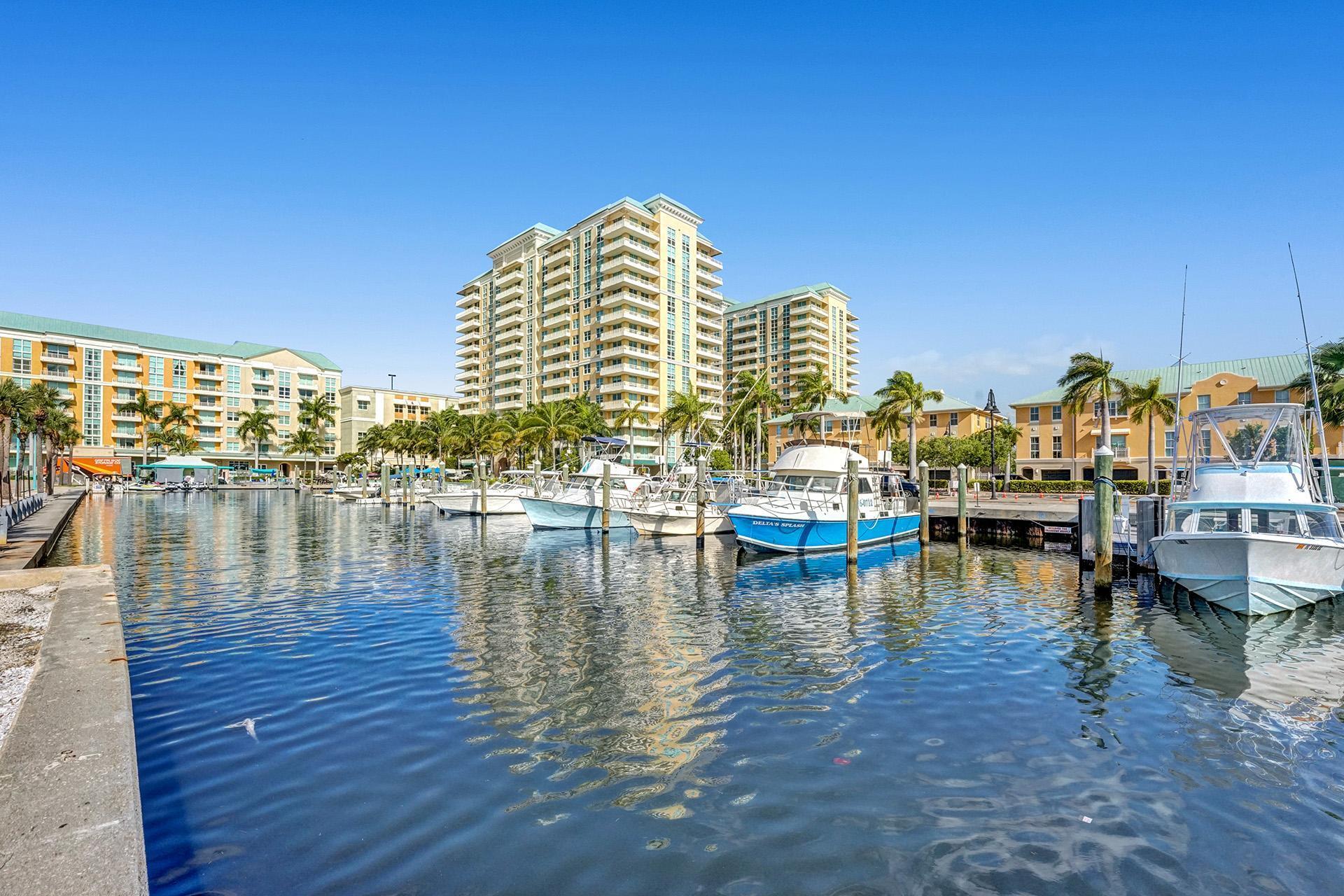 a view of water with boats and trees in the background