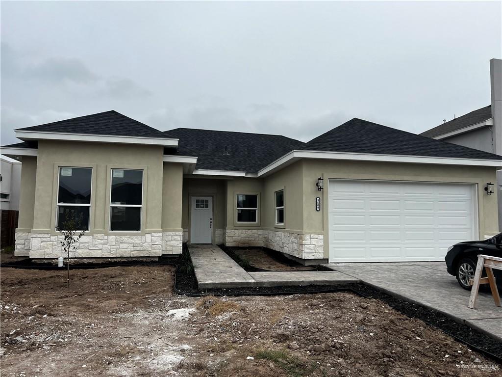 a front view of a house with yard