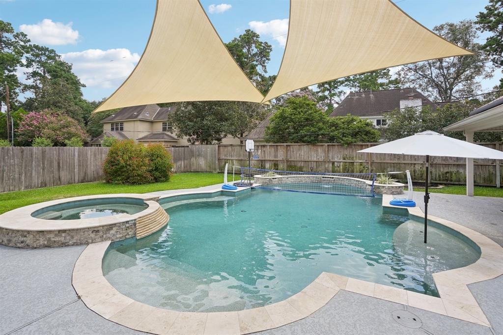 a view of a backyard with swimming pool