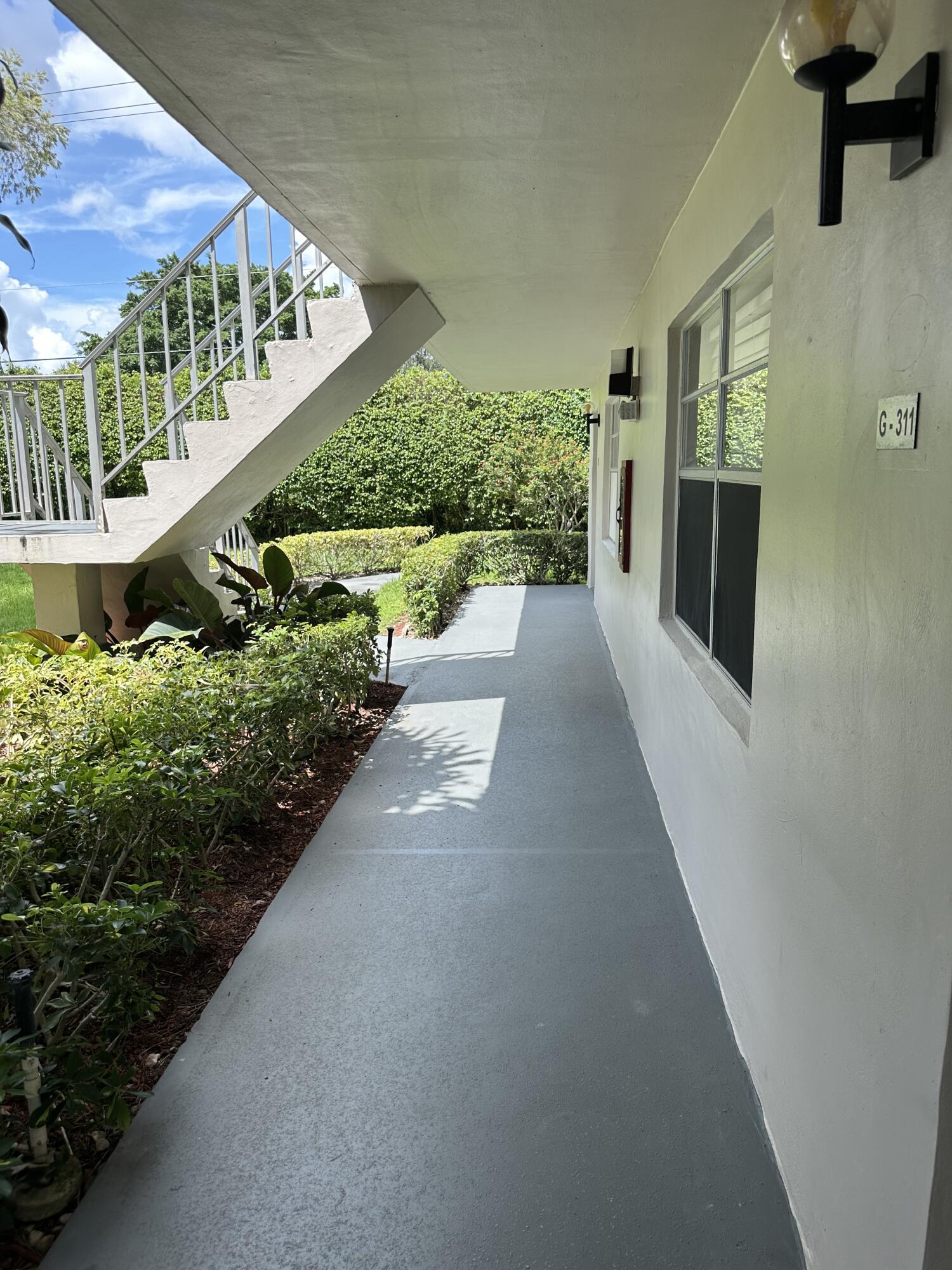 a view of a back yard from a balcony